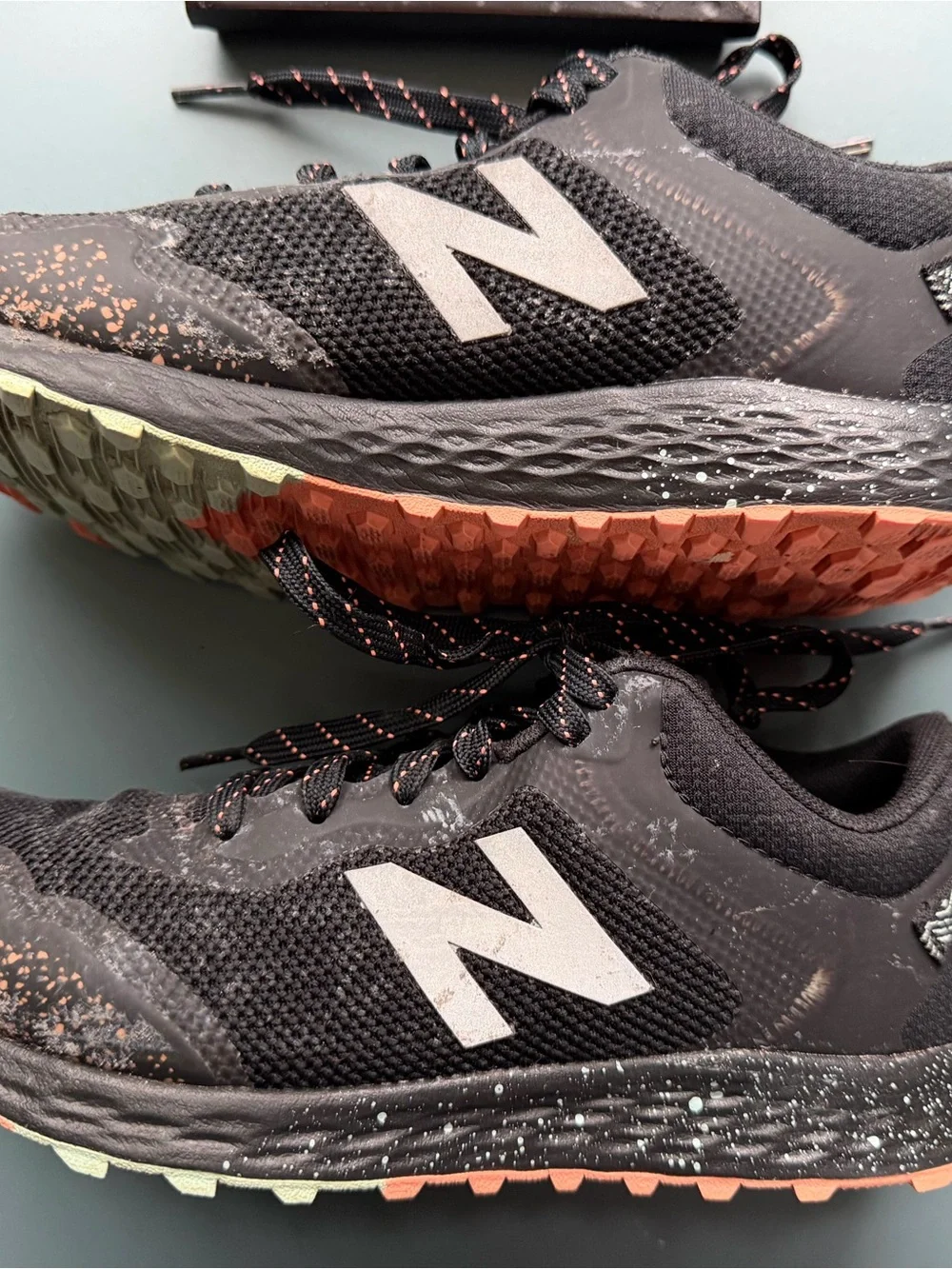 New Balance Kids Black Sneakers with orange/teal Accent